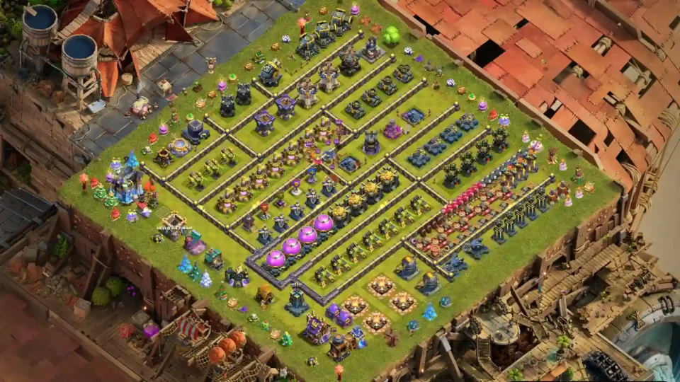 TH18 progress base with parallel wall lanes and organised rows of defences and resources
